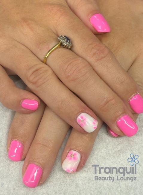 Pink and white nail art, with blooming flowers