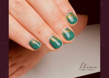 Green nail polish with bronze flakes on short natural nails