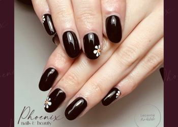 Black gel polish on long natural nails with small hand painted daisies