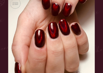 Dark red velvet effect gel polish on long natural nails